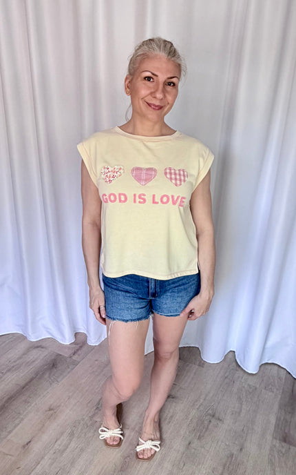 Relaxed-fit faith-inspired top with heart patches and breathable French terry knit fabric.
