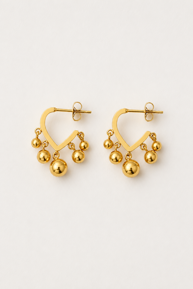 Open V-shaped 18k gold hoop earrings with polished dangling gold ball beads on a light neutral background.