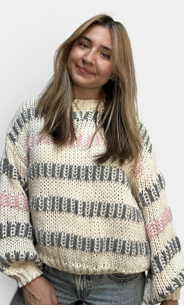 Women's ivory multi striped chunky knit sweater with a relaxed fit.