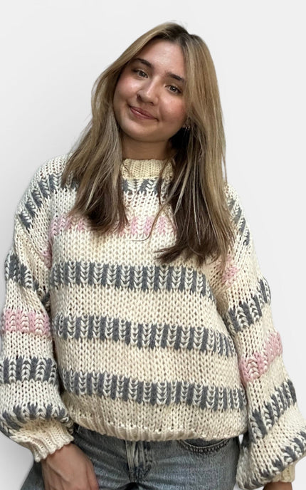 Women's ivory multi striped chunky knit sweater with a relaxed fit.
