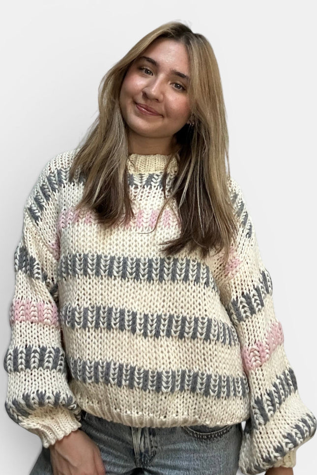 Women's ivory multi striped chunky knit sweater with a relaxed fit.