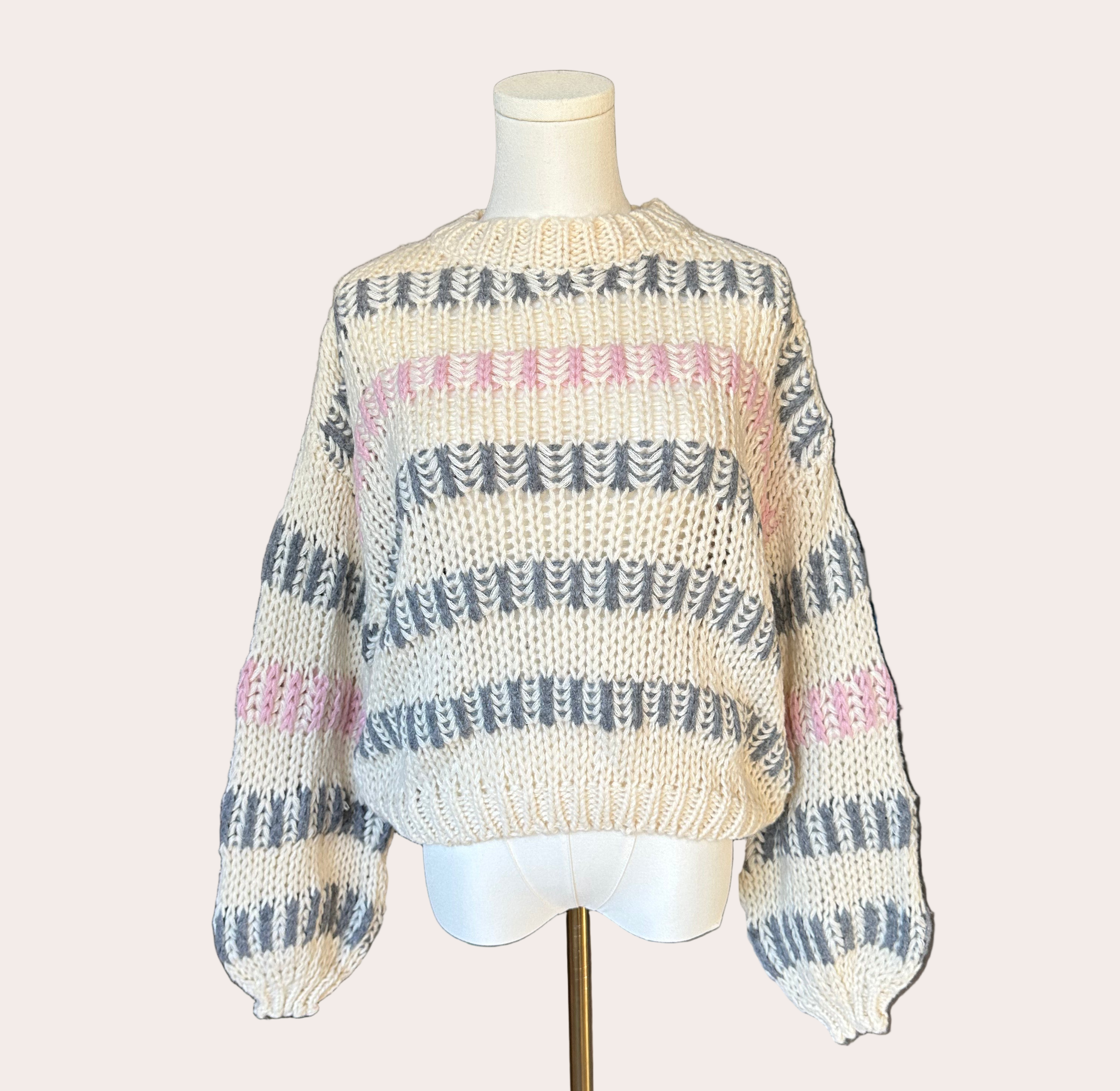Ivory multi chunky stripe sweater with drop shoulders and voluminous sleeves, textured knit, photographed on a Soft Linen background for Justyna Grace Boutique.