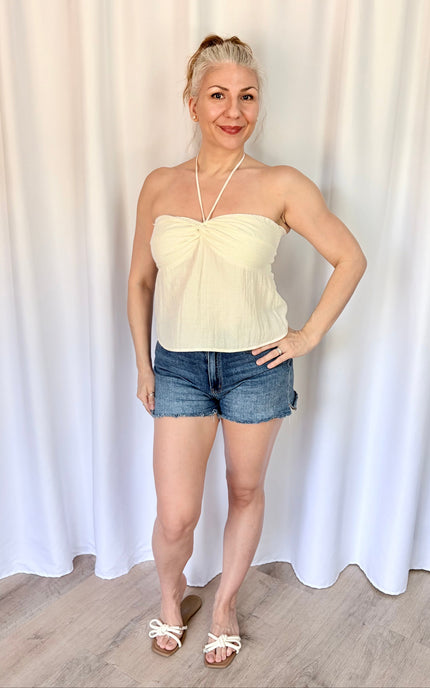 Lightweight ivory top with bead accents, beautiful drape, and effortless style.