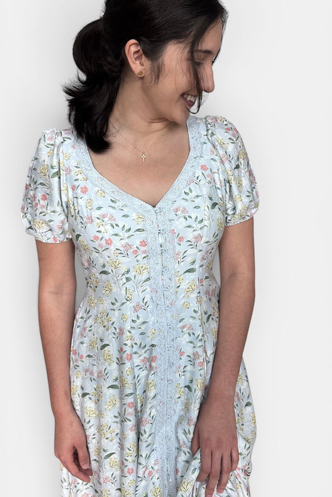 Floral maxi dress with sweetheart neckline, puff sleeves, and belted waist