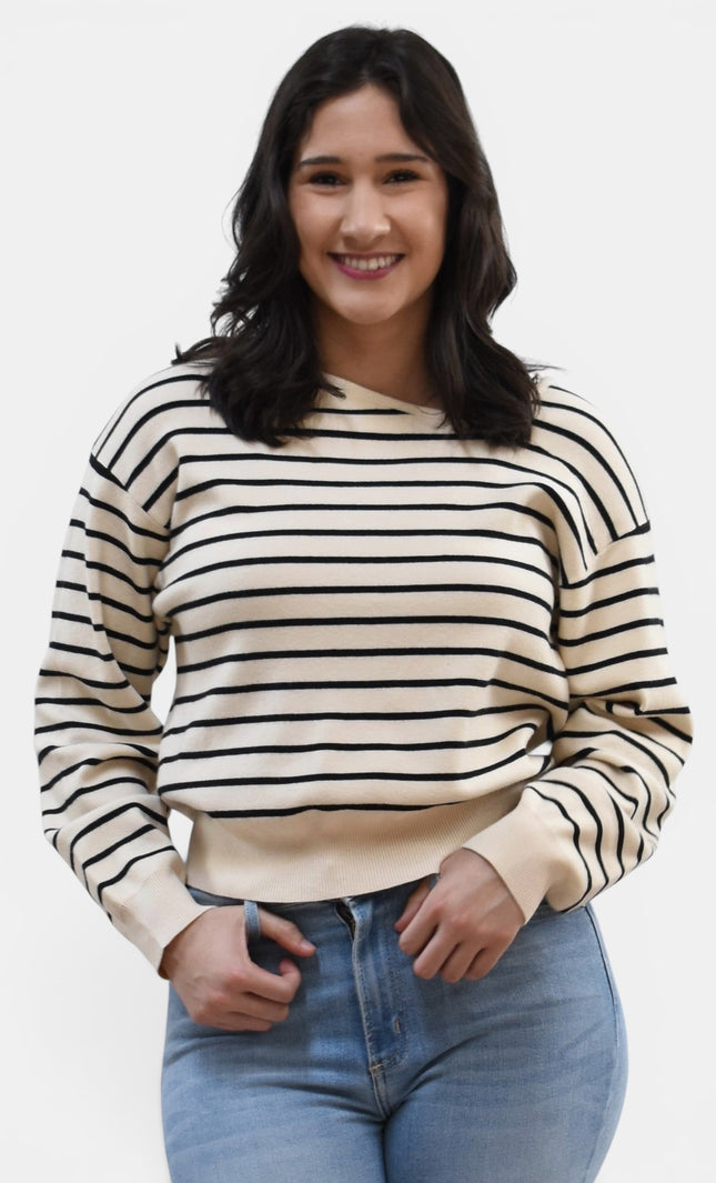 Front view of women's asymmetric boat neck long sleeve knit top.