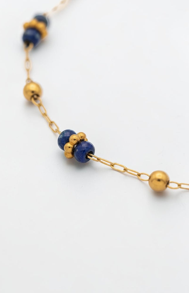 3mm polished gold beads shown between lapis stations.