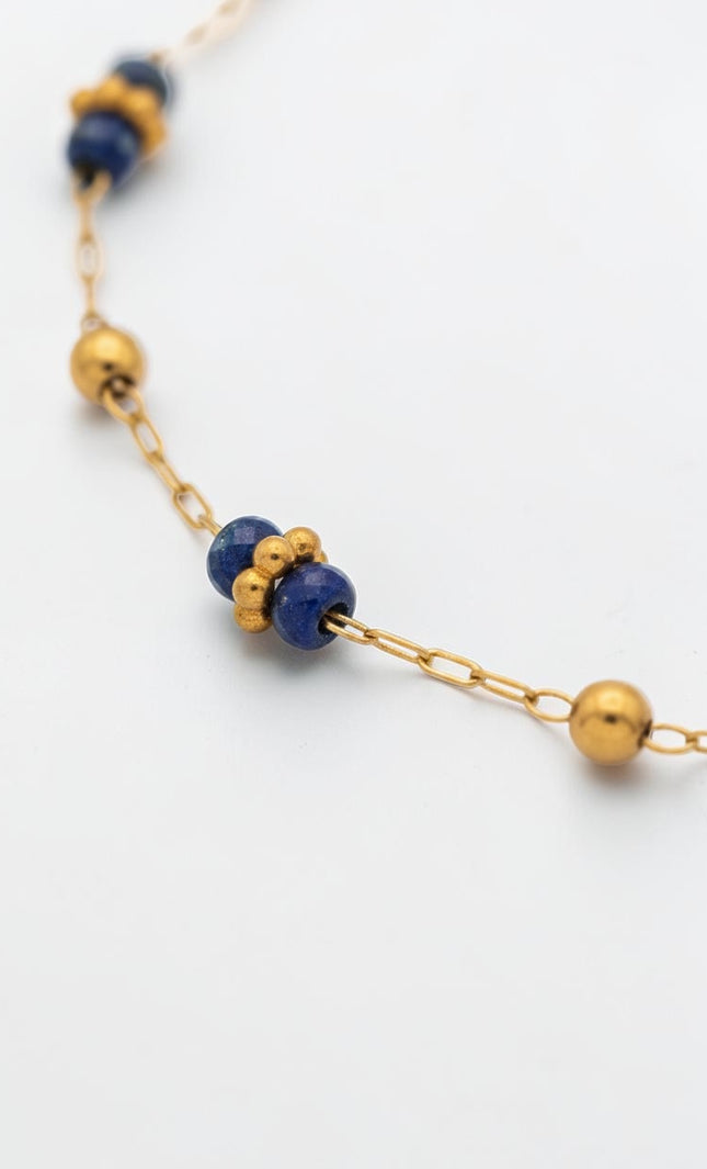 3mm polished gold beads shown between lapis stations.