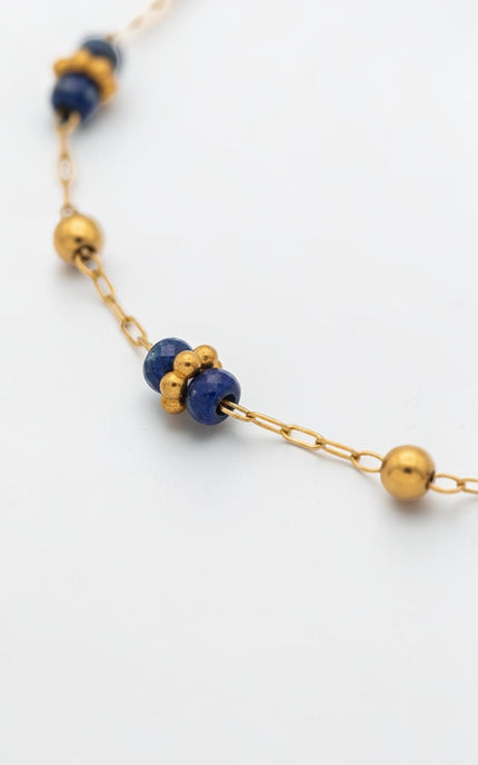 3mm polished gold beads shown between lapis stations.