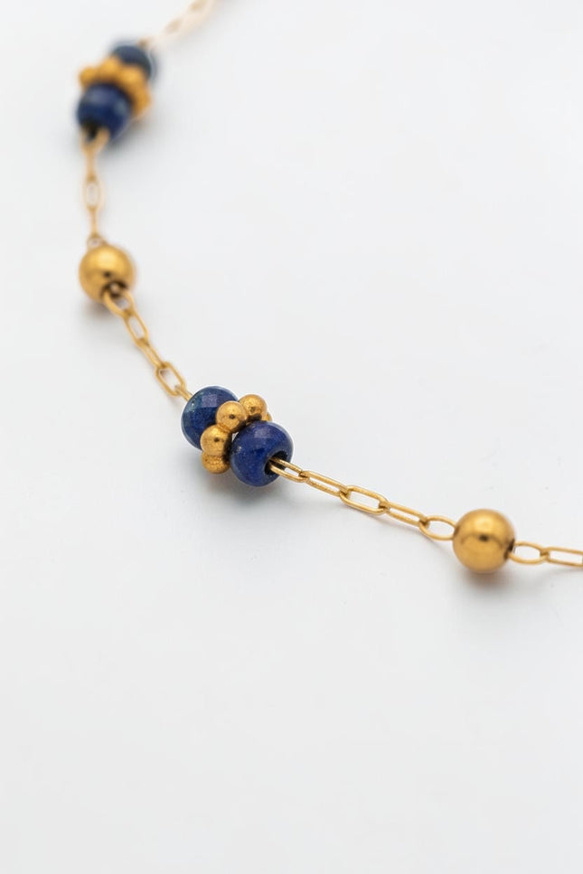 3mm polished gold beads shown between lapis stations.