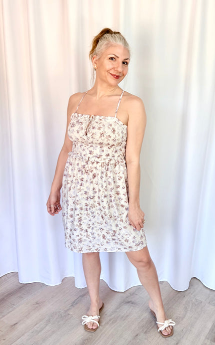 Lightweight lavender floral mini dress with pockets crafted from breathable rayon challis.