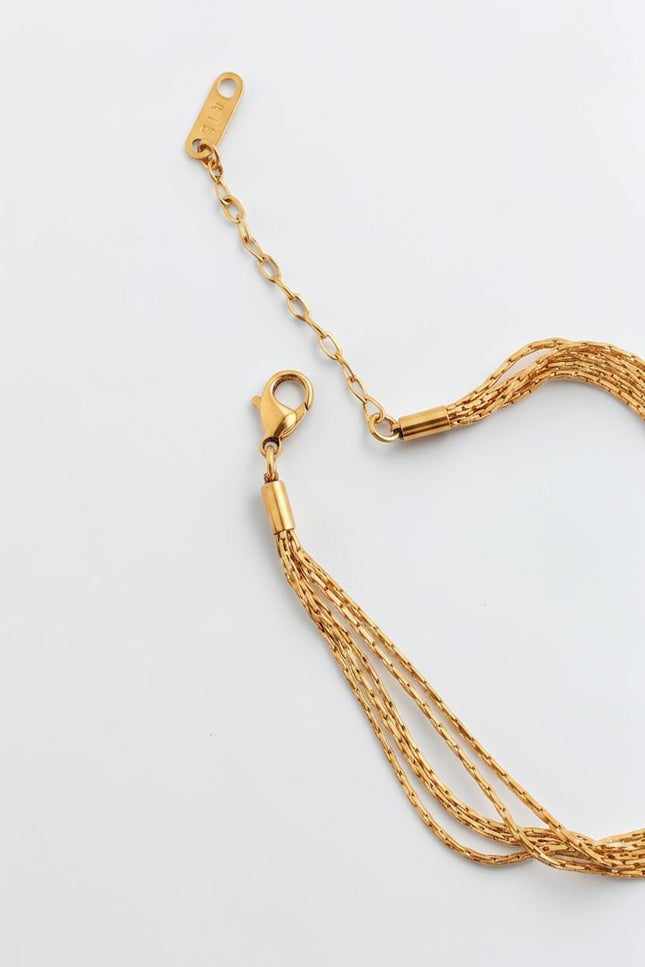 Close‑up of lobster clasp and extension chain for adjustable fit.