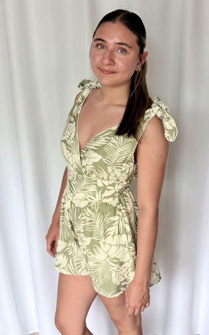 Side profile of lightweight rayon‑blend romper with soft drape and palm tree print
