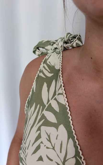 Adjustable tie shoulder straps shown in dusty sage tropical print.