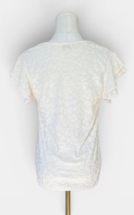 An off-white textured short-sleeve top displayed on a mannequin torso against a plain white background.