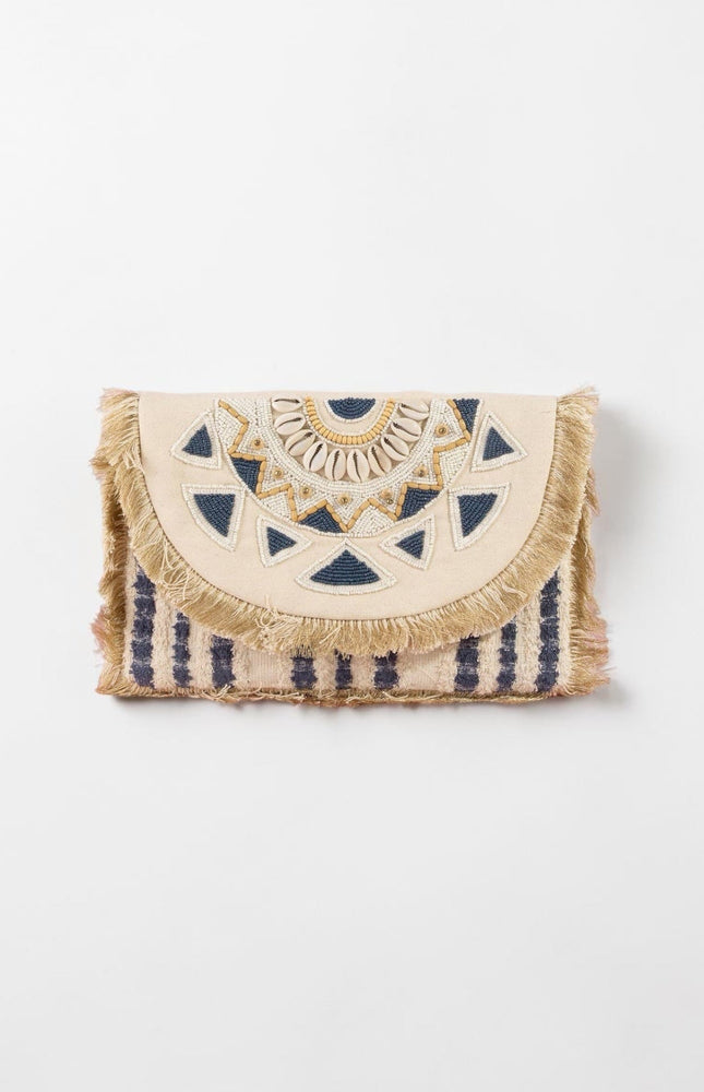 Navy and cream oversized beaded clutch with mandala‑inspired design and fringe trim.