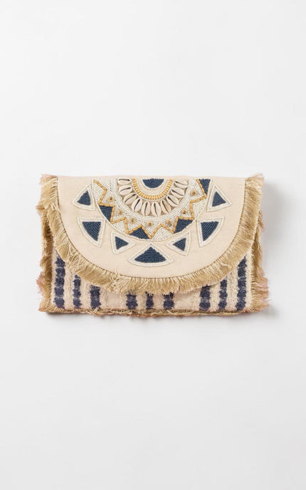 Navy and cream oversized beaded clutch with mandala‑inspired design and fringe trim.