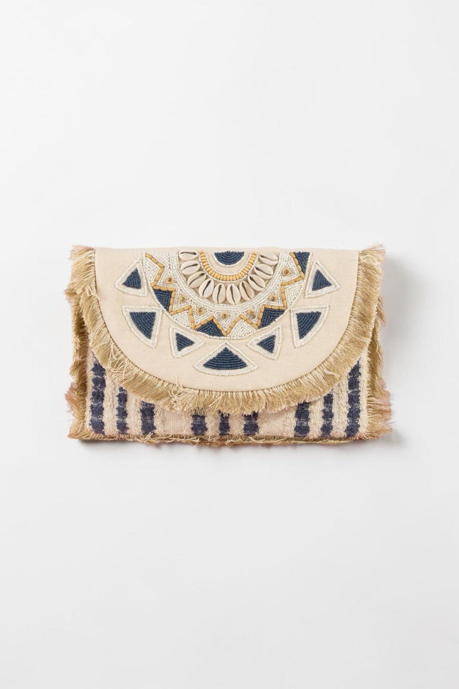 Navy and cream oversized beaded clutch with mandala‑inspired design and fringe trim.