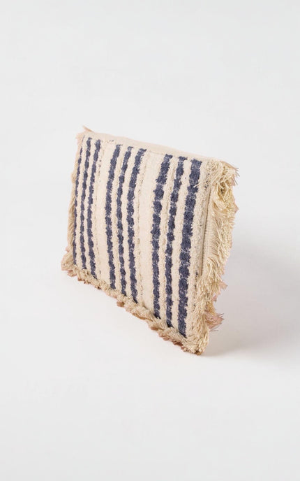 Oversized navy and cream envelope clutch featuring intricate hand‑applied beadwork, mandala pattern, fringe trim, and fold‑over closure.