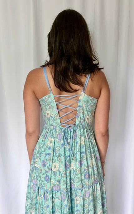 A tight, detailed crop of the adjustable corset tie-up back, showcasing the craftsmanship and adjustable fit.