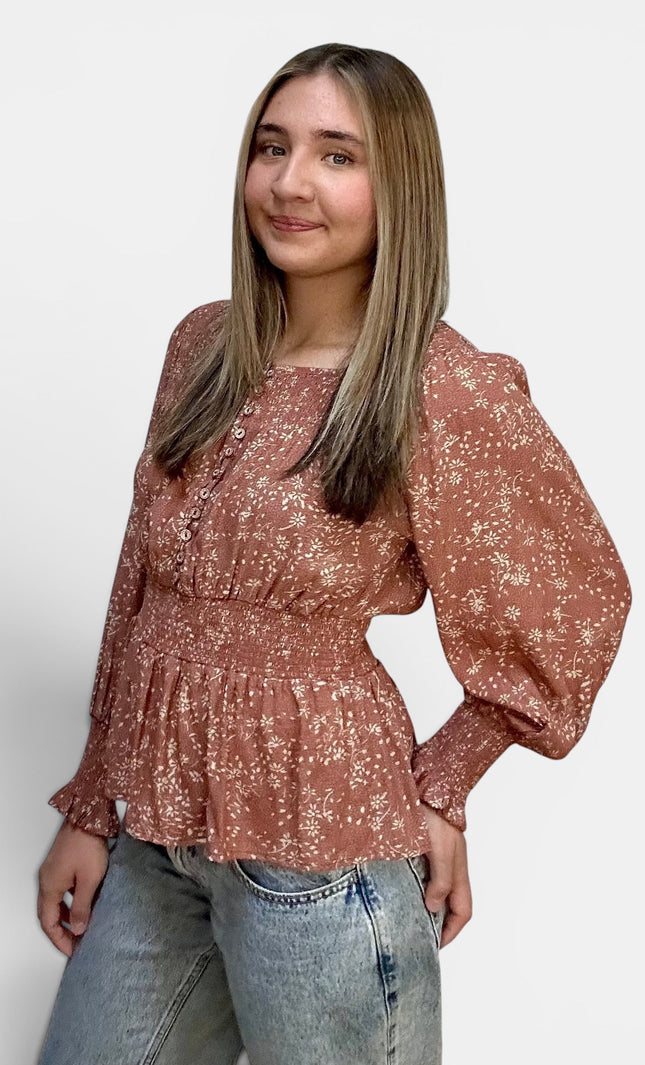 Women's floral rayon blouse with smocked shoulders and cuffs.