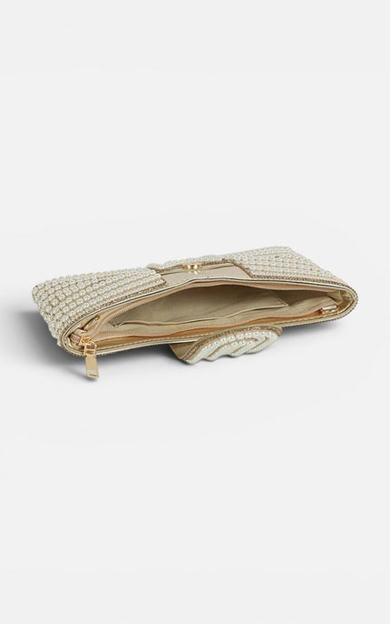 Interior view of the clutch highlighting the tonal lining and the slim, 1-inch wide compartment designed for evening essentials.