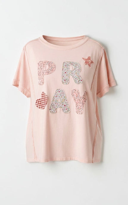 A ghost mannequin product shot of the Pray Patchwork Cotton Tee in white, showcasing its relaxed, boxy silhouette, clean round neck, and how the lightweight 100% cotton knit drapes naturally.