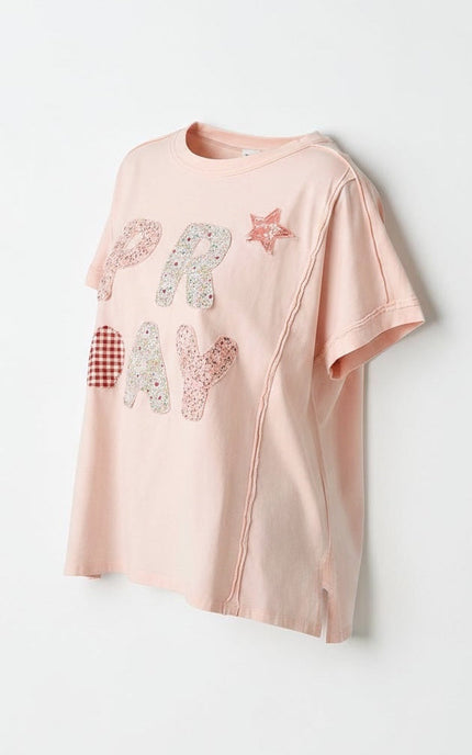A side view of ghost mannequin product shot of the Pray Patchwork Cotton Tee in white, showcasing its relaxed, boxy silhouette, clean round neck, and how the lightweight 100% cotton knit drapes naturally.