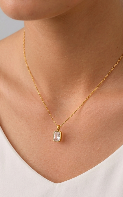 Rectangular zircon pendant necklace worn on the neck, showing its minimal, everyday sparkle.