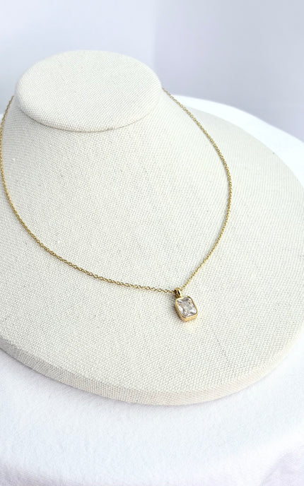 Slim gold chain displayed on form with smooth 18k PVD finish.