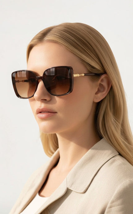 Oversized retro square‑round sunglasses with polycarbonate frames and 100% UV protection.