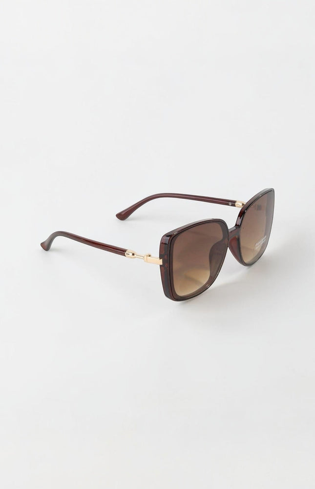 Modern oversized retro sunglasses with square‑round lenses and chic neutral frames.