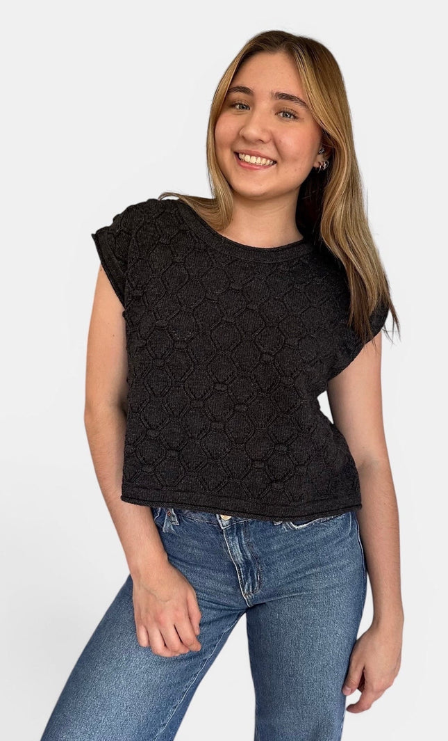Front view of women’s rolled hem sweater top with popcorn knit texture.