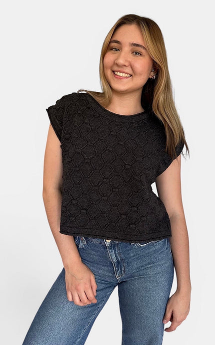 Front view of women’s rolled hem sweater top with popcorn knit texture.