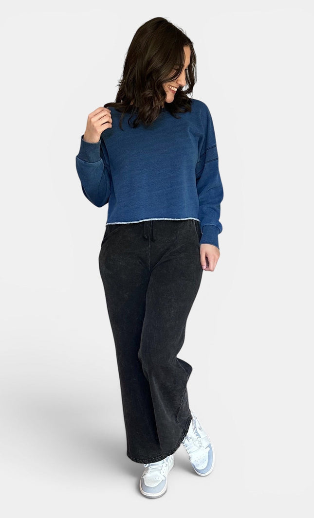 Women's oversized fleece lined denim wash sweatshirt front view.