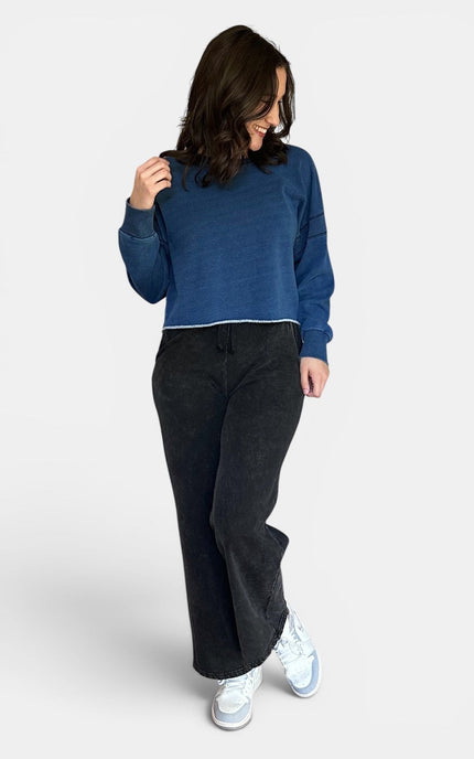 Women's oversized fleece lined denim wash sweatshirt front view.