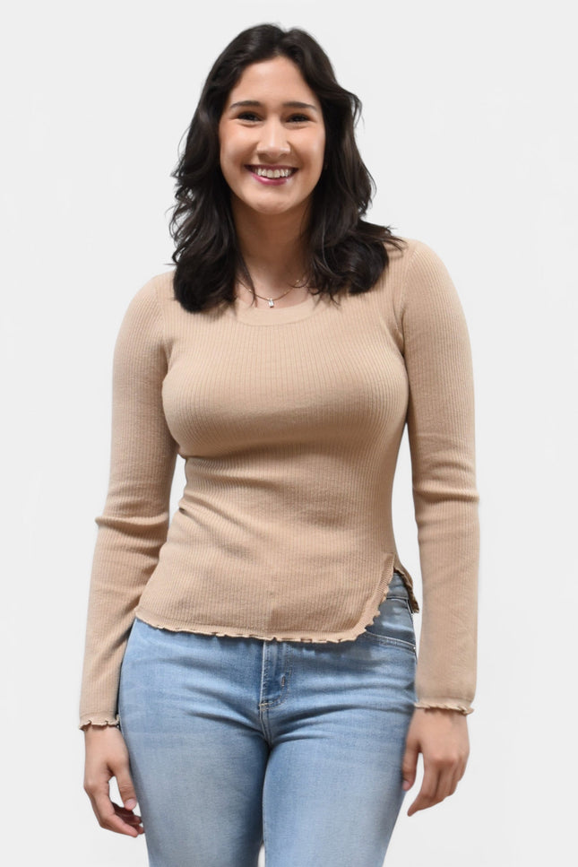 Front view of women's ruffle neckline sweater with front slit detail.