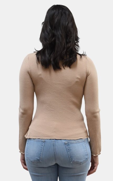 Back view of women's ruffle neckline sweater with front slit detail.