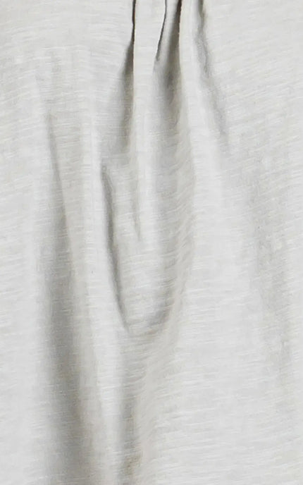 Close-up of light gray fabric with subtle texture