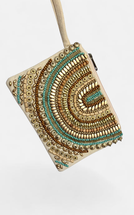 A square beige clutch bag decorated with intricate circular and semi-circular patterns of gold, bronze, and turquoise beads, shown against a plain white background.