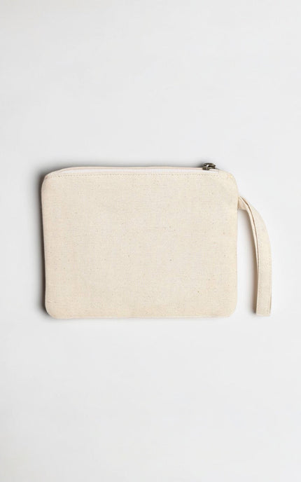 Beige clutch bag with a strap on a light gray background