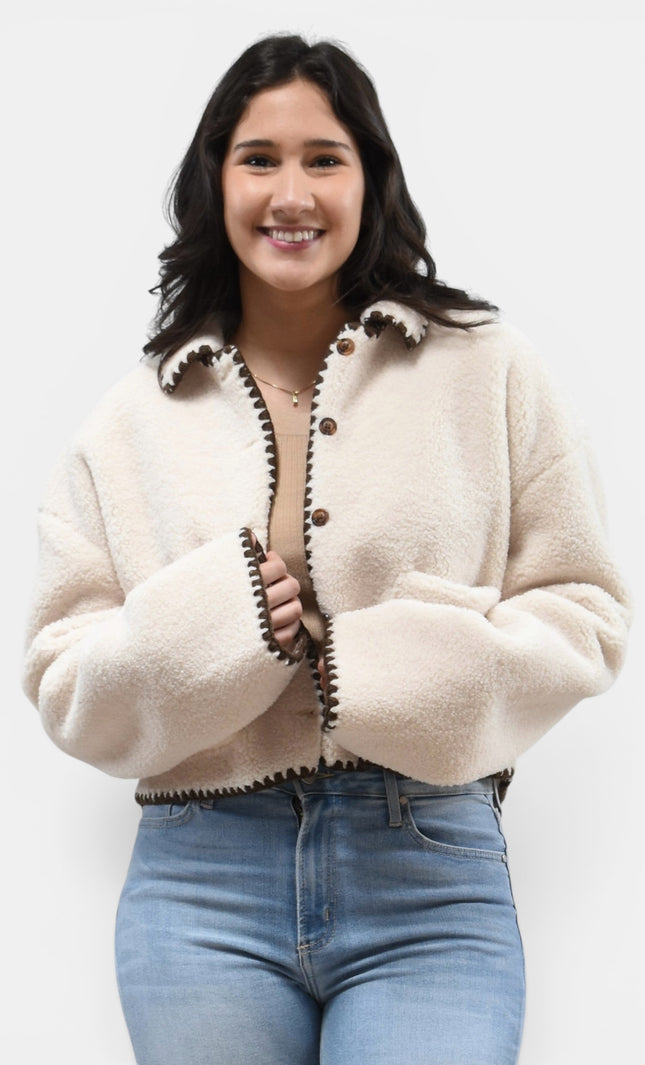 Front angle of cozy sherpa jacket with contrast stitch detail.
