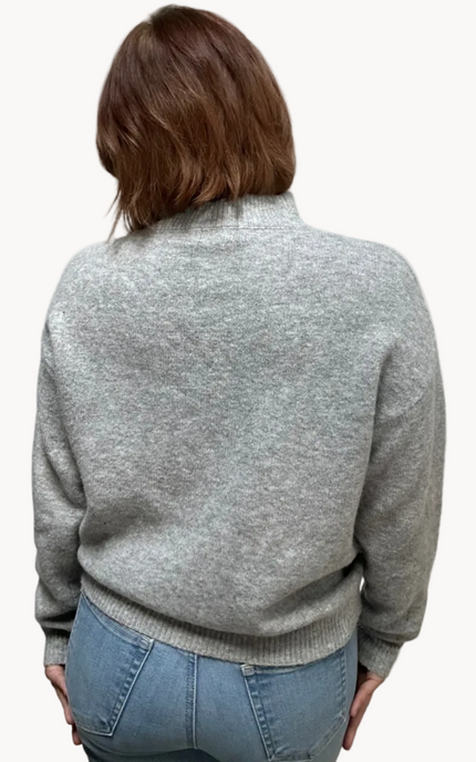 Heather grey crew-neck sweater with soft contrast stitching along the neckline and sleeves, midweight knit with stretch, photographed on a Soft Linen background for Justyna Grace Boutique.