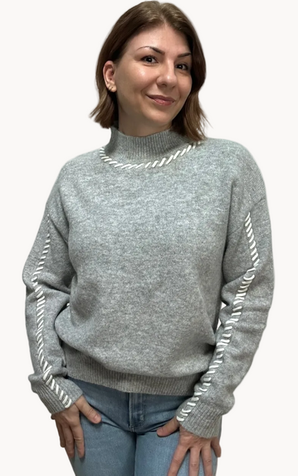 Heather grey crew-neck sweater with soft contrast stitching along the neckline and sleeves, midweight knit with stretch, photographed on a Soft Linen background for Justyna Grace Boutique.