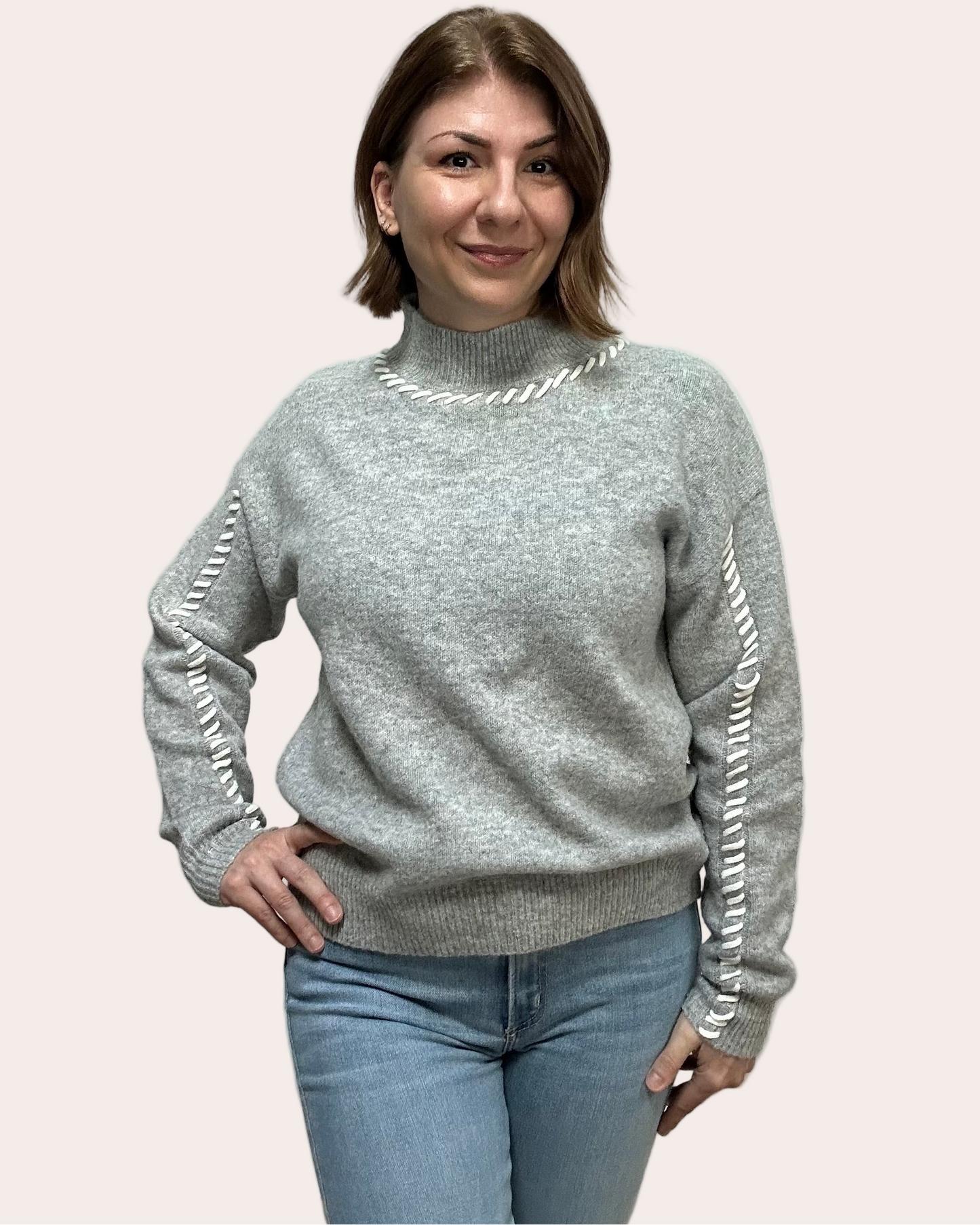 Heather grey crew-neck sweater with soft contrast stitching along the neckline and sleeves, midweight knit with stretch, photographed on a Soft Linen background for Justyna Grace Boutique.
