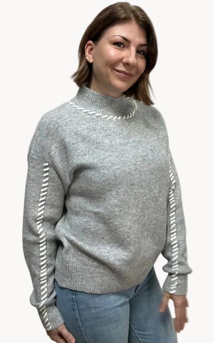 Heather grey crew-neck sweater with soft contrast stitching along the neckline and sleeves, midweight knit with stretch, photographed on a Soft Linen background for Justyna Grace Boutique.