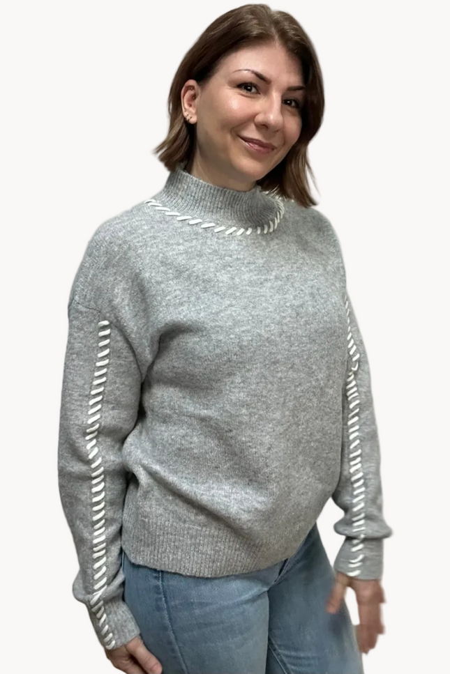 Heather grey crew-neck sweater with soft contrast stitching along the neckline and sleeves, midweight knit with stretch, photographed on a Soft Linen background for Justyna Grace Boutique.
