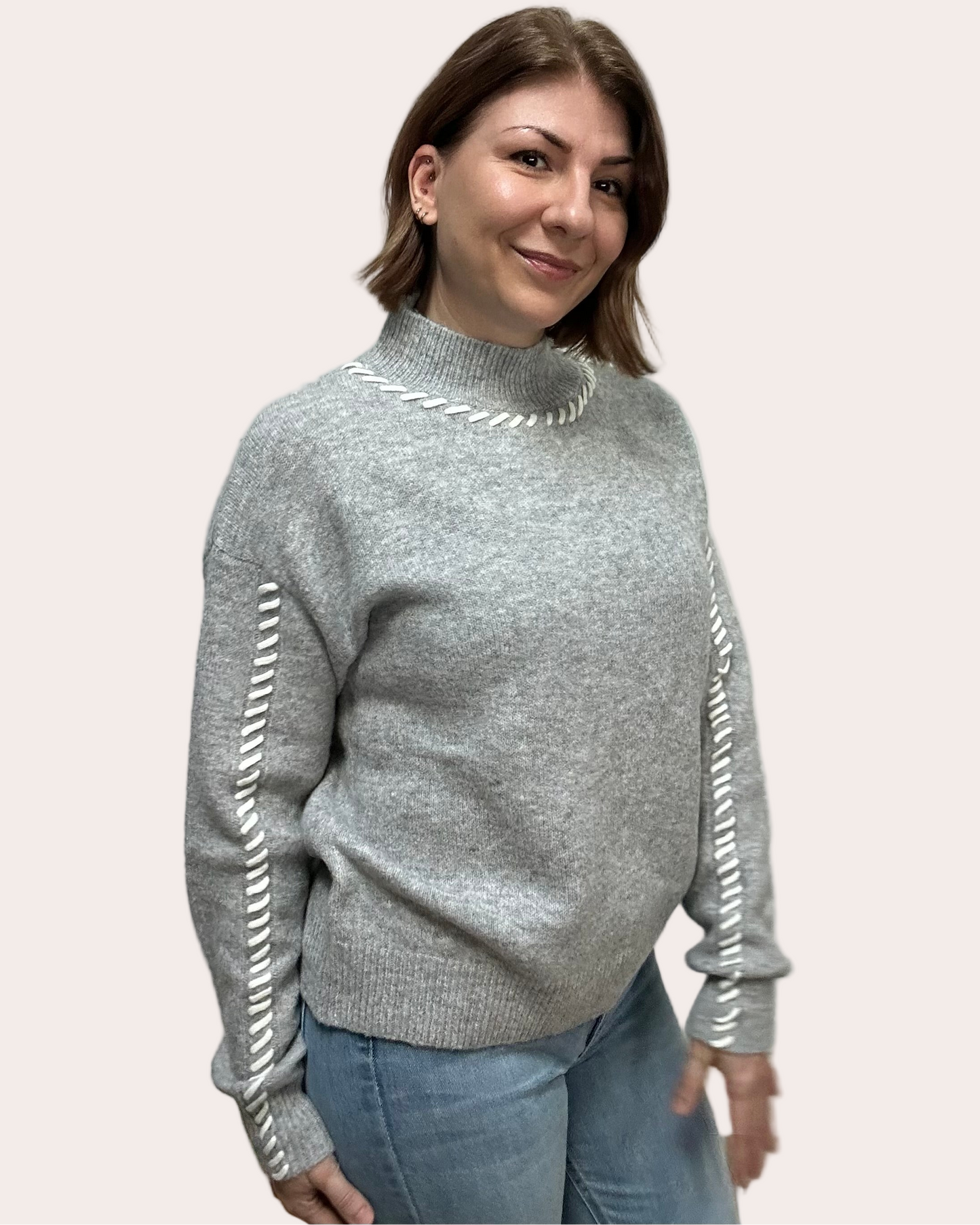 Heather grey crew-neck sweater with soft contrast stitching along the neckline and sleeves, midweight knit with stretch, photographed on a Soft Linen background for Justyna Grace Boutique.