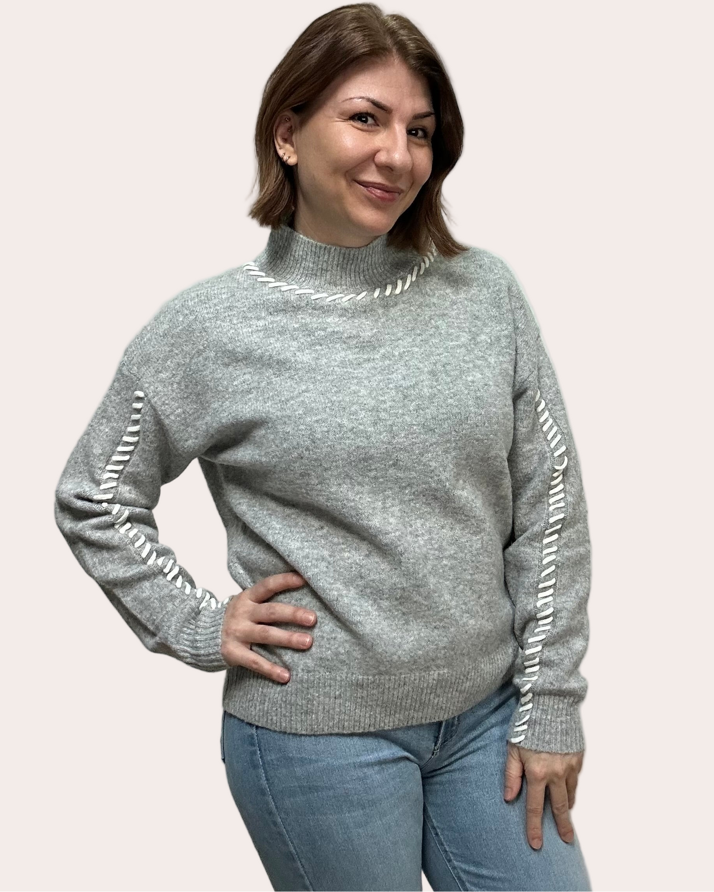 Heather grey crew-neck sweater with soft contrast stitching along the neckline and sleeves, midweight knit with stretch, photographed on a Soft Linen background for Justyna Grace Boutique.