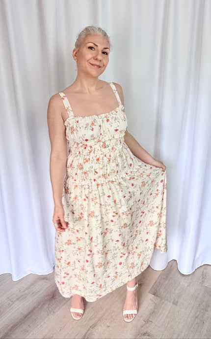 Front view romantic midi dress with sweetheart neckline and soft feminine movement.