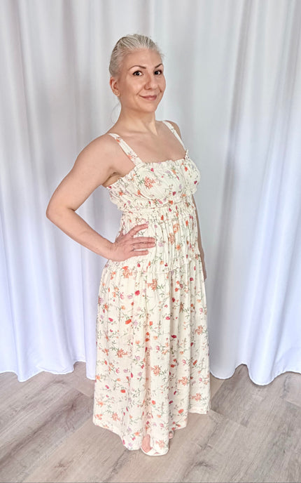 Side view of sweetheart neckline midi dress showing flattering bodice and flowing skirt.